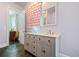 ' bathroom featuring double sinks, star-themed cabinets, and beautiful tile floors at 2909 Jones Mill Rd, Atlanta, GA 30360
