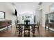 Open-concept dining area showcasing hardwood floors and seamless connection to the modern kitchen at 2909 Jones Mill Rd, Atlanta, GA 30360