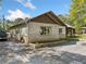 A single story home with a mix of brick and wood siding, featuring well maintained landscaping at 2909 Jones Mill Rd, Atlanta, GA 30360