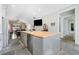 Contemporary kitchen with a large island featuring barstool seating and stainless steel appliances at 2909 Jones Mill Rd, Atlanta, GA 30360