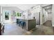 Open kitchen with a large center island with barstool seating, stainless appliances, and tons of natural light at 2909 Jones Mill Rd, Atlanta, GA 30360
