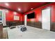 This is a versatile room with wainscotting, a mounted television, and an adjacent doorway at 2909 Jones Mill Rd, Atlanta, GA 30360