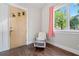 Cozy sitting room featuring hardwood floors, large windows with views, and a classic rocking chair at 2909 Jones Mill Rd, Atlanta, GA 30360