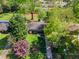 Aerial view of a charming home with a well-manicured lawn, mature trees, and a welcoming front entrance at 3099 Dove Way, Decatur, GA 30033