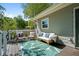 Cozy back deck with comfortable seating, an outdoor rug, and a relaxing atmosphere for enjoying the surrounding greenery at 3099 Dove Way, Decatur, GA 30033