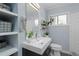 Stylish bathroom with modern vanity, sleek fixtures, and window for natural light at 3099 Dove Way, Decatur, GA 30033