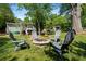 Backyard fire pit surrounded by Adirondack chairs, creating a cozy and inviting space for outdoor gatherings and relaxation at 3099 Dove Way, Decatur, GA 30033