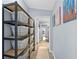 Hallway features ample storage with shelving units and connects to other areas of the house at 3099 Dove Way, Decatur, GA 30033
