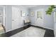 Hallway featuring hardwood floors, neutral paint, and decor creating a seamless transition between rooms at 3099 Dove Way, Decatur, GA 30033