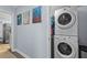 Convenient laundry area with stacked washer and dryer, plus nearby access to the kitchen at 3099 Dove Way, Decatur, GA 30033