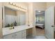 Bright bathroom featuring a large mirror, white vanity, and a separate toilet room at 4337 Orchard Park Ct, Stone Mountain, GA 30083