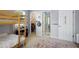A bedroom with a bunk bed, closet, and ensuite bath at 4337 Orchard Park Ct, Stone Mountain, GA 30083