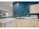 Clean kitchen with white cabinets, a double sink, and a view of the dining area at 4337 Orchard Park Ct, Stone Mountain, GA 30083