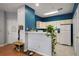 Well-lit kitchen with white appliances, cabinetry, and a view of the living space at 4337 Orchard Park Ct, Stone Mountain, GA 30083