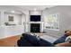 Inviting living room featuring a cozy fireplace, neutral tones, and abundant natural light at 4337 Orchard Park Ct, Stone Mountain, GA 30083