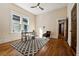 Bright bedroom with hardwood floors, large window, and neutral decor at 501 Dargan Sw Pl, Atlanta, GA 30310