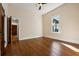 Bedroom featuring original hardwood floors, two windows, and classic trim at 501 Dargan Sw Pl, Atlanta, GA 30310