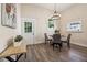 Bright dining area with wood floors, table with chairs, and a view of the outside at 501 Dargan Sw Pl, Atlanta, GA 30310