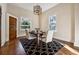Bright dining room features hardwood floors, natural light, and elegant furnishings at 501 Dargan Sw Pl, Atlanta, GA 30310