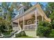 Charming two-story home with a large porch, inviting curb appeal, and well-maintained landscaping at 501 Dargan Sw Pl, Atlanta, GA 30310