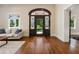 Beautiful foyer with a decorative glass front door and gleaming hardwood floors at 501 Dargan Sw Pl, Atlanta, GA 30310