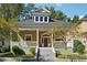Charming craftsman-style home featuring a covered front porch and a landscaped yard at 501 Dargan Sw Pl, Atlanta, GA 30310