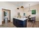 Bright open kitchen with island, room for dining, and stainless sink at 501 Dargan Sw Pl, Atlanta, GA 30310