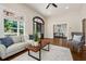 Inviting living room featuring a fireplace, sofa, and hardwood floors throughout at 501 Dargan Sw Pl, Atlanta, GA 30310