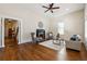 Elegant living room with hardwood floors, fireplace, and an open entryway to the hallway at 501 Dargan Sw Pl, Atlanta, GA 30310