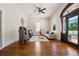 Bright living room featuring hardwood floors, fireplace, and decorative front door at 501 Dargan Sw Pl, Atlanta, GA 30310