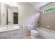 Bathroom featuring a bath/shower combination and bright natural light at 7045 W Mountain Xing, Cumming, GA 30041
