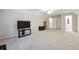 Large bonus room with TV, furnishings and bright light from the windows at 7045 W Mountain Xing, Cumming, GA 30041