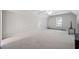 Spacious, carpeted bonus room with a ceiling fan and ample natural light at 7045 W Mountain Xing, Cumming, GA 30041