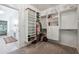 Spacious walk-in closet with custom shelving, drawers, and ample storage space at 7045 W Mountain Xing, Cumming, GA 30041