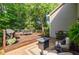 Inviting back deck with outdoor seating, a grill, and a relaxing atmosphere at 7155 Hartsfield Pl, Suwanee, GA 30024
