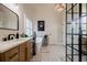 Bright bathroom with a standalone tub, stylish tile floor, and modern fixtures at 7155 Hartsfield Pl, Suwanee, GA 30024