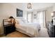 Comfortable bedroom with ample natural light and neutral decor at 7155 Hartsfield Pl, Suwanee, GA 30024
