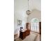 Well-lit office space with a large arched window, shiplap walls, and a statement light fixture at 7155 Hartsfield Pl, Suwanee, GA 30024