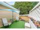 The backyard patio offers a cozy outdoor seating area with an umbrella and room for entertaining at 905 Downyshire Dr, Lawrenceville, GA 30044