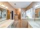 Bright primary bathroom features double vanities, and a large walk-in shower at 905 Downyshire Dr, Lawrenceville, GA 30044
