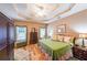 Comfortable bedroom with trey ceilings, hardwood floors, and lots of natural light at 905 Downyshire Dr, Lawrenceville, GA 30044