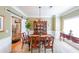 Elegant dining room featuring a chandelier, wainscoting, and ample natural light at 905 Downyshire Dr, Lawrenceville, GA 30044