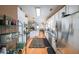 Well-lit kitchen features stainless steel appliances, granite countertops, and hardwood floors at 905 Downyshire Dr, Lawrenceville, GA 30044