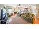 Cozy living room with fireplace, comfortable seating, and seamless flow to the kitchen at 905 Downyshire Dr, Lawrenceville, GA 30044