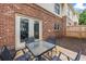 Cozy patio area with outdoor seating perfect for entertaining off the back of the home at 168 Constitution Blvd # 12, Lawrenceville, GA 30046