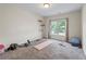 Bright bedroom with neutral walls, carpet, and featuring workout equipment at 168 Constitution Blvd # 12, Lawrenceville, GA 30046