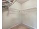 Walk-in closet with multiple levels of metal shelving, ideal for maximum storage at 168 Constitution Blvd # 12, Lawrenceville, GA 30046
