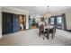 Open dining room with neutral color palette connects to the kitchen and powder room at 168 Constitution Blvd # 12, Lawrenceville, GA 30046