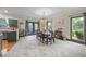 Bright dining room features a modern chandelier and gray framed windows at 168 Constitution Blvd # 12, Lawrenceville, GA 30046