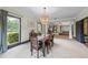 Open dining room with large windows offering view of outdoor greenery at 168 Constitution Blvd # 12, Lawrenceville, GA 30046